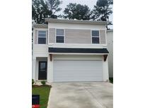 Two-story home with white garage door, neutral siding, and black front door at 4856 Station Road-Lot 21, Union City, GA 30349