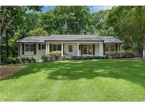 Charming one-story home with a lush front lawn and inviting curb appeal at 4309 King Valley Se Dr, Smyrna, GA 30082