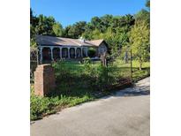 Charming home with wrought iron gate and a large front yard at 435 Johnson Ferry Nw Rd, Atlanta, GA 30328