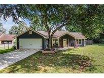 Charming single-Gathering home with a well-manicured lawn and a two-car garage at 50 Blackberry Lane, Covington, GA 30016