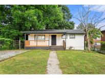 Charming single-story home featuring a welcoming front porch and well-maintained lawn at 132 Lamar Nw Ave, Atlanta, GA 30314