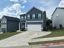 Charming two-story home featuring a two-car garage and a well-maintained front yard at 370 Winston Cir, Canton, GA 30114