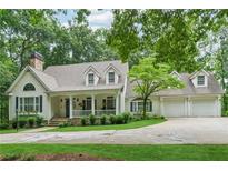 Charming home with a manicured lawn, inviting front porch and an attached three car garage at 34 Johnston Nw Row, Cartersville, GA 30121