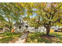 Charming one-story home with dormer, well-kept lawn, sidewalk, and mature trees at 1471 Hardin Dr, College Park, GA 30337
