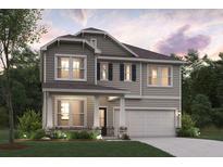 Two-story home showcasing stone accents, neutral siding, a covered porch, and attached two car garage at 2655 Mourning Dove Dr (Lot 50), Grayson, GA 30017