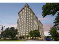 Striking exterior shot of building featuring a high-rise structure and manicured greenery at 2479 Peachtree Ne Rd # 301, Atlanta, GA 30305