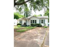 Charming single story home with white siding, a cozy front porch, and inviting curb appeal at 3604 Orchard Cir, Decatur, GA 30032