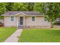 Charming single-story home with a well-maintained front lawn and inviting entrance at 2245 Dauphine St, Atlanta, GA 30344