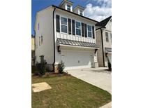 Charming two-story home featuring white siding, black shutters, and a convenient two-car garage at 1250 Winterhaven Dr, Cumming, GA 30041