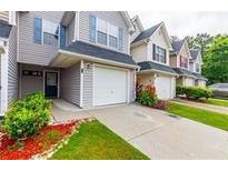 Charming townhouse with a one car garage and landscaped front yard offering curb appeal at 6726 Gallant Se Ct # 30, Mableton, GA 30126