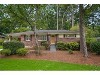 Charming brick home featuring a welcoming entrance and mature landscaping, creating inviting curb appeal at 2790 Laurel Ridge Dr, Decatur, GA 30033