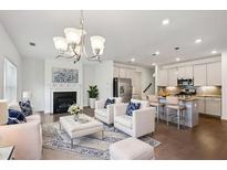 Bright living room featuring a fireplace, hardwood floors, and lots of natural light at 1637 Short Shadow Ln, Snellville, GA 30078