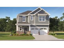 Charming two-story home with gray siding, white trim, double garage, and well-manicured lawn at 1924 Logan Se Ln, Conyers, GA 30094