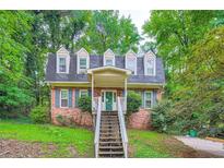Charming brick home with a welcoming entrance and lush green surroundings at 2867 Holly Oaks Dr, Marietta, GA 30062