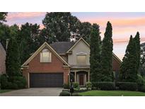 Charming two-story home with brick accents, well-manicured landscaping, and a two-car garage at 3405 Glenrose Trail Trl, Atlanta, GA 30341