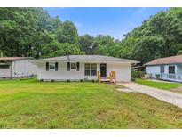 Charming single-story home with a well-maintained lawn and inviting curb appeal at 2049 Phillips Dr, Atlanta, GA 30315