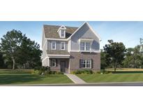 Charming two-story home featuring a combination of brick and siding, complemented by a well-manicured lawn and landscaping at 313 Fraley Dr, Woodstock, GA 30188