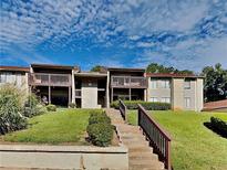 Inviting exterior showcasing two-story apartments with well-maintained landscaping and stairways leading to private balconies at 3575 Oakvale Rd # 305, Decatur, GA 30034