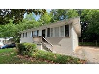 Charming single-story home with a brick exterior and a well-maintained front yard at 1829 Goddard Se St, Atlanta, GA 30315