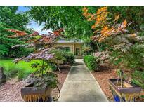 Inviting front walkway lined with lush landscaping, leading to the modern home's entrance at 1181 Fairview Ne Rd, Atlanta, GA 30306