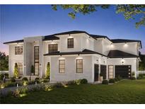 Stunning two-story home featuring a combination of brick and vinyl siding, a manicured lawn, and a three car garage at 3769 High Green Dr, Marietta, GA 30068