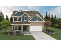 Charming two-story home showcasing brick and blue siding, landscaped yard and a two-car garage at 11857 Rizvan Pl, Covington, GA 30014