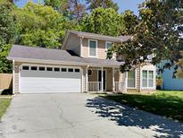 Charming two-story home with a two car garage and a well-maintained front yard at 3637 Chinaberry Ln, Snellville, GA 30039