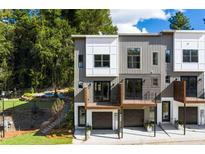 Modern townhome featuring a private balcony and attached garage in a desirable neighborhood at 2328 Mason Drive Dr, Atlanta, GA 30316