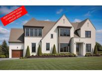 New construction home with a professionally landscaped yard, neutral colors, and a three car garage at 125 Spring Dr, Roswell, GA 30075