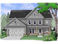 Charming two-story home featuring a covered front porch, gray siding, attached garage and manicured landscaping at 1045 Birch Way, Loganville, GA 30052