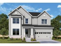 Charming two-story home featuring a two-car garage and covered front porch at 218 Strawberry Lane, Woodstock, GA 30189