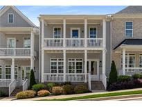 Charming two-story home with a double porch, complemented by manicured landscaping and sidewalk appeal at 2125 Parkside Ln, Roswell, GA 30076