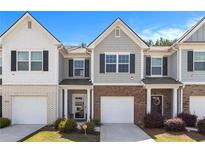 Charming townhouse with a brick front and attached one-car garage, nestled in a desirable community at 5696 Union Pointe Dr, Union City, GA 30291