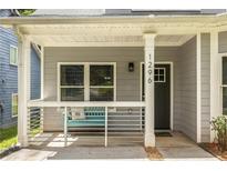 Charming front porch with seating area and modern railing, perfect for relaxing at 1296 Plaza Sw Ave, Atlanta, GA 30310