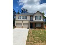 Two story home with a two car garage, dark shutters, and brick accents at 742 Great Oak Pl, Villa Rica, GA 30180
