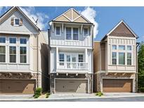 Charming townhome with a stone facade, second story balcony, and attached garage in a desirable location at 164 Blakemore Dr, Smyrna, GA 30080