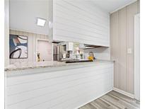 Charming kitchen featuring white cabinets, modern countertops, and stainless steel appliances at 190 Judy Sw Ln, Atlanta, GA 30315