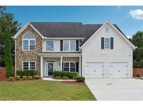Charming two-story home with stone accents, manicured lawn, and a two-car garage at 6298 Gothards Ln, Douglasville, GA 30134