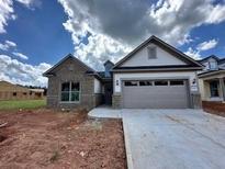 Beautiful new construction home featuring a two-car garage and modern architectural details at 5444 Miravista Way, Hoschton, GA 30548