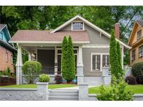Charming craftsman-style home featuring a covered front porch, well-manicured landscaping, and welcoming curb appeal at 1232 Lucile Sw Ave, Atlanta, GA 30310