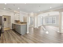 Bright living room featuring modern floors, neutral paint, and an open floor plan at 4203 Stratford Commons # 4203, Decatur, GA 30033