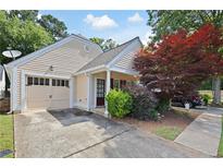 Charming single-Gathering home featuring an attached two-car garage and well-manicured landscaping at 5069 Kathryn Glen Dr, Acworth, GA 30101