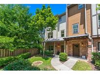 Charming townhome with brick accents, lush landscaping, and a welcoming front yard at 1325 Oakview Rd, Decatur, GA 30030