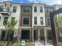 Beautiful three-story townhome with modern architecture and neutral color palette at 358 Olmstead Way # 25, Alpharetta, GA 30022