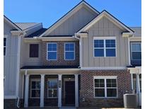 Beautiful new two-story home with brick and siding and a covered front porch at 4849 Walkers Green, Mableton, GA 30126