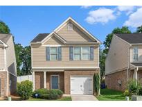 Charming two-story home with brick and siding facade, blue shutters, and well-maintained landscaping at 368 Rankin Cir, Mcdonough, GA 30253