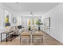 Bright living room featuring large windows, modern decor, and an open, airy layout perfect for entertaining at 388 Pratt Dr # 2113, Atlanta, GA 30315