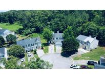 Inviting neighborhood aerial view features manicured lawns, mature trees, and well-maintained homes at 49 Hampton Dr, Cartersville, GA 30121