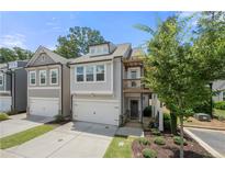 Charming two-story townhome with an attached garage and a cozy second-floor balcony at 774 Belrose Dr, Smyrna, GA 30080