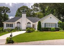 Charming single-story home with a well-manicured lawn and lovely landscaping at 2355 Quail Creek Ter, Buford, GA 30519